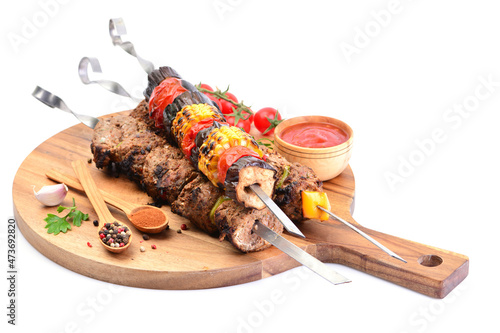  Kebab with spices and vegetables on a white background