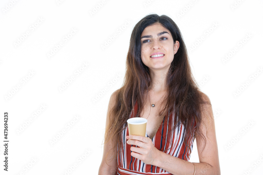 Attractive girl holding coffee hot drink carton cup in white background Attractive girl holding coffee hot drink carton cup in white background