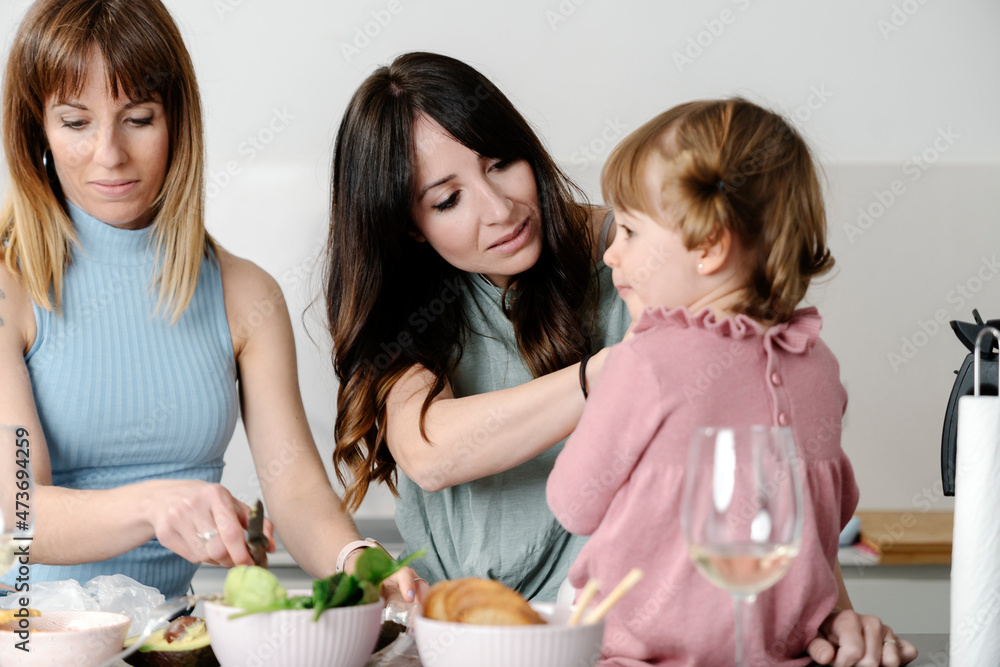 Mothers cooking healthy food as a family Mothers cooking healthy food as a family
