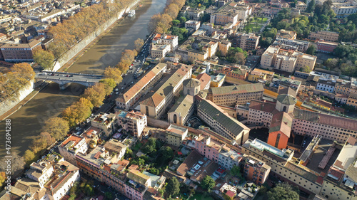 Aerial drone flight over famous Rome district of Trastevere with beautiful Roman architecture, Italy