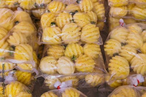 Pineapples in plastic bags photo