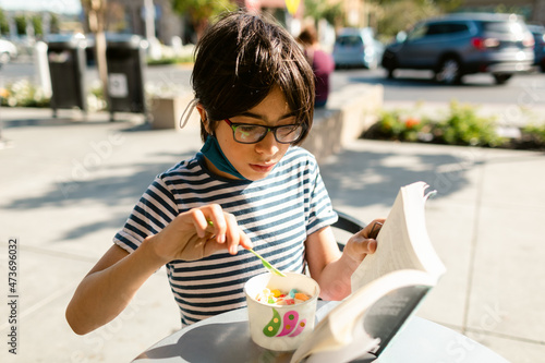 Boy eating frozen yogurt  photo