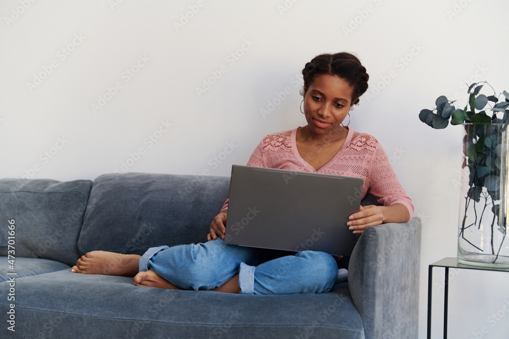 Portrait of a beautiful girl watching movie online at home Portrait of a beautiful girl watching movie online at home