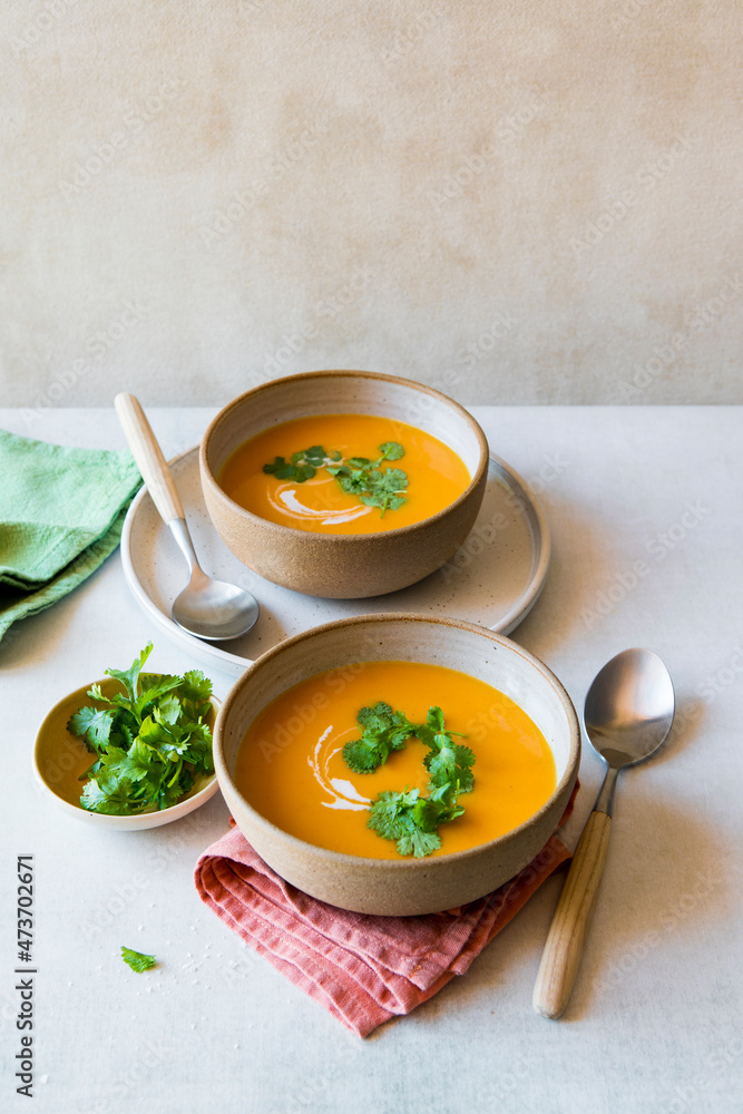 Two servings of butternut vegetable soup Two servings of butternut vegetable soup