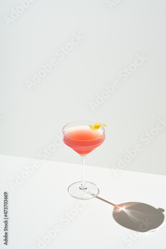 Cosmopolitan cocktail with lemon peel