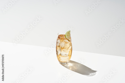 Dark n Stormy cocktail with lime photo