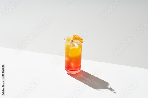 Glass of tequila sunrise cocktail photo