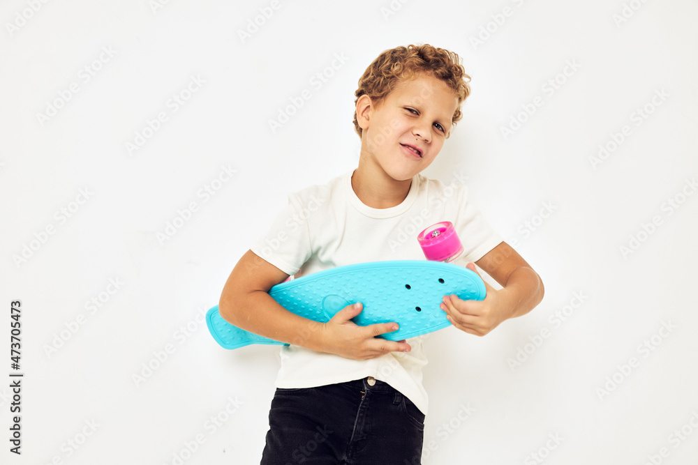 Portrait of young smiling kid skateboard in hands posing lifestyle childhood Portrait of young smiling kid skateboard in hands posing lifestyle childhood