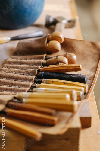 Various tools on wooden table in joinery
