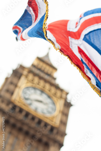 Big Ben behind a British flag photo