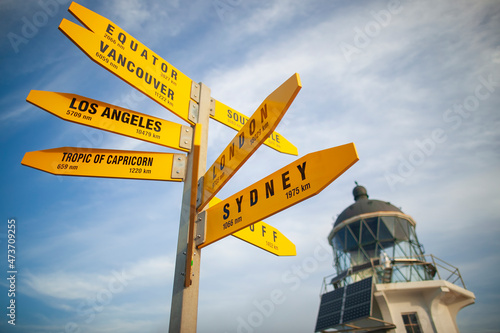 A signpost in front of the Cape Reinga Lighthouse. 