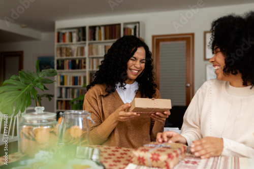 Happy women with Christmas gifts