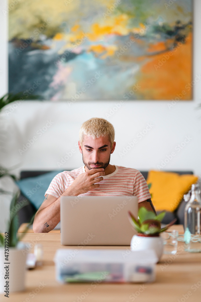 Thoughtful freelancer working at home Thoughtful freelancer working at home