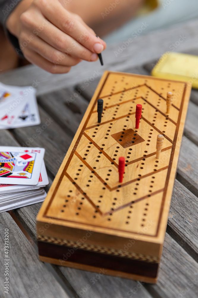 Young Girl Playing Cribbage make peg move Stock Photo Adobe Stock