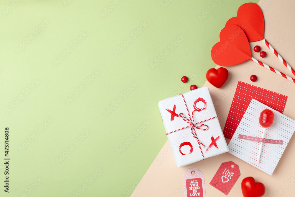 Valentine's Day accessories on two tone background, top view