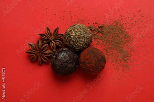 Concept of sweets with truffles on red background