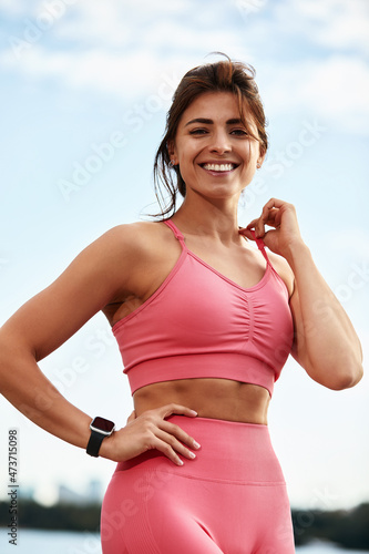 Young beautiful woman with a slim figure goes in for sports at beach. Fitness, sport and healthy lifestyle concept.