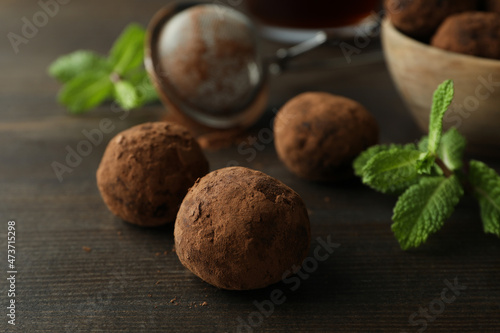 Concept of sweets with truffles on dark wooden background