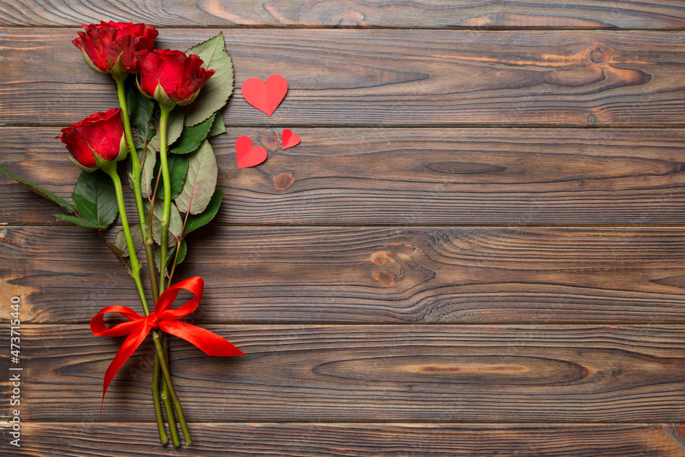 Valentine day composition with rose flower and red heart on table. Top view, flat lay, copy space Holiday concept Valentine day composition with rose flower and red heart on table. Top view, flat lay, copy space Holiday concept