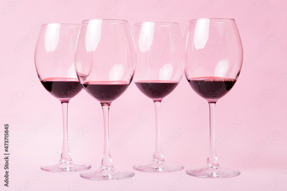 Many glasses of red wine at wine tasting. Concept of red wine on colored background. Top view, flat lay design Many glasses of red wine at wine tasting. Concept of red wine on colored background. Top view, flat lay design