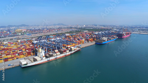 Aerial top view containers ship cargo business commercial trade logistic and transportation of international import export by container frieght cargo ship in the open seaport. photo