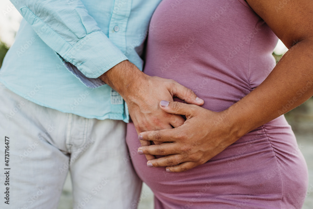 Hands on pregnant belly Hands on pregnant belly