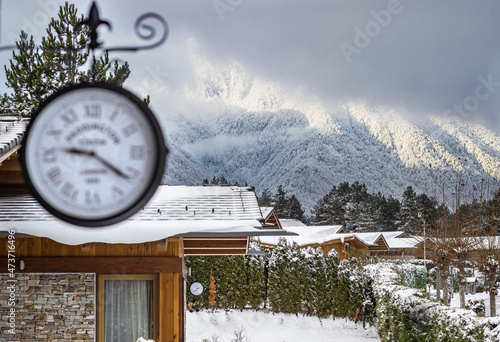 mouniain view with fresh snow from the villa  with outside clock on ski resort photo