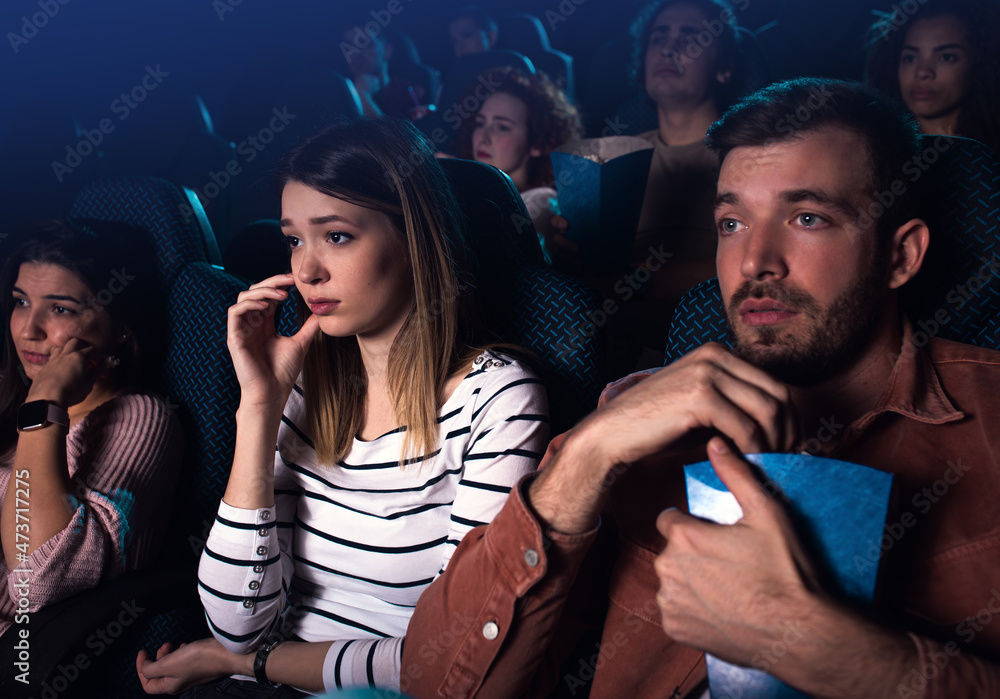 Group of people watching sad movie in cinema. Group of people watching sad movie in cinema.