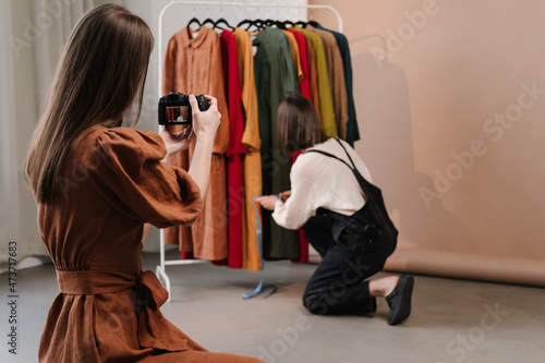 Woman taking picture of fashion designer
