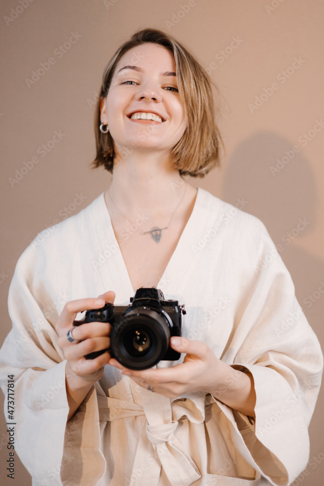 Serious photographer taking picture in studio Serious photographer taking picture in studio