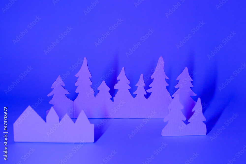 Fototapeta premium Futuristic modern abstract happy New Year 2022, Merry Chrstmas concept. Pine tree from paper on neon bright violet blue background, copy space, banner for your site, invitation, flyer