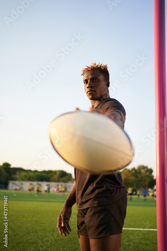 Black rugby player on sports field