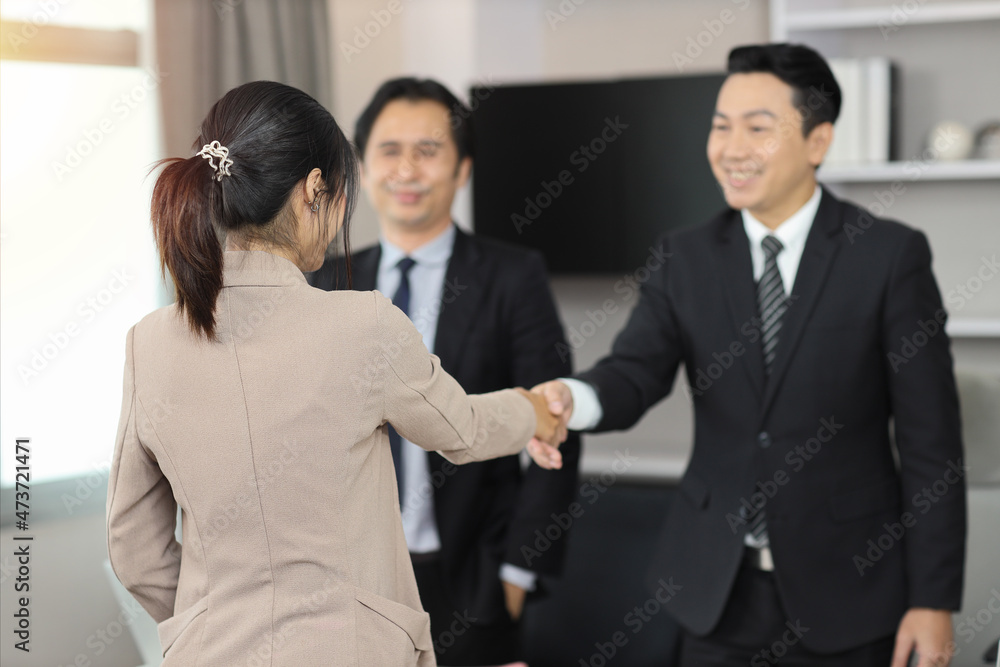 Rear view business happy people shaking hands meaning of introduction, greeting, success negotiation or finishing up meeting. Gesturing connection deal concept. Rear view business happy people shaking hands meaning of introduction, greeting, success negotiation or finishing up meeting. Gesturing connection deal concept.