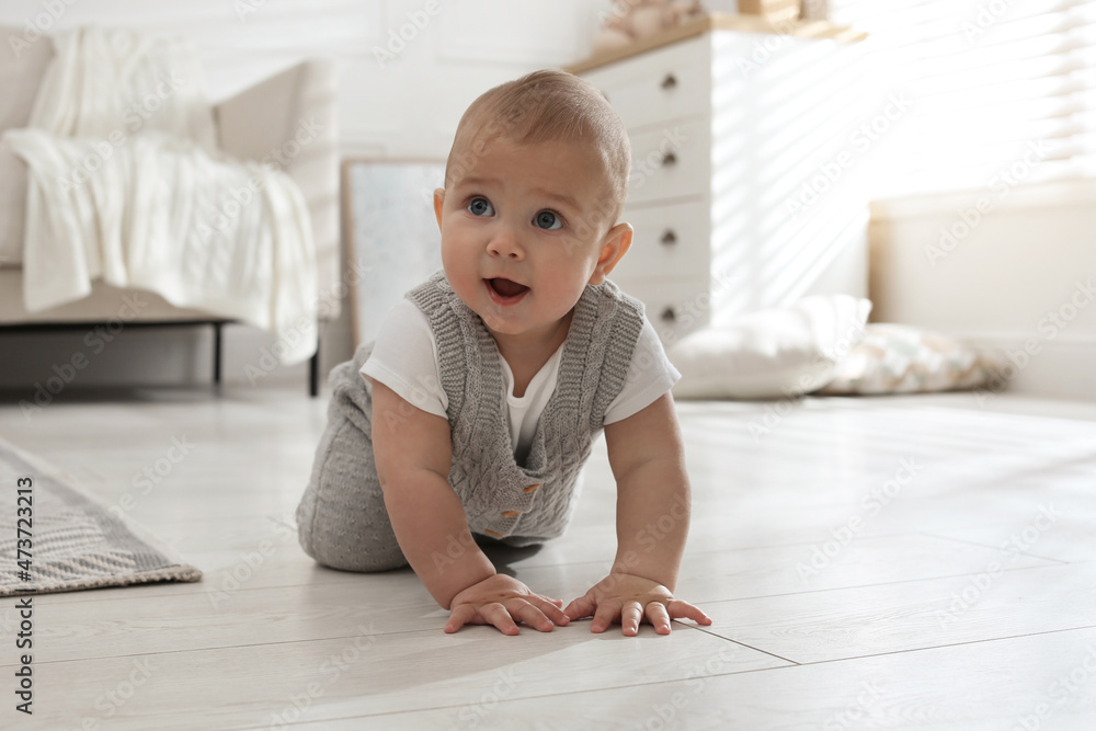 © New Africa - Cute baby crawling on floor at home