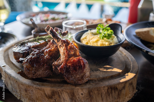 Grilled lamb carre with warm couscous salad, roasted vegetables