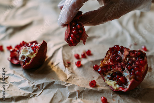 Pomegranate seeds in the hands. photo
