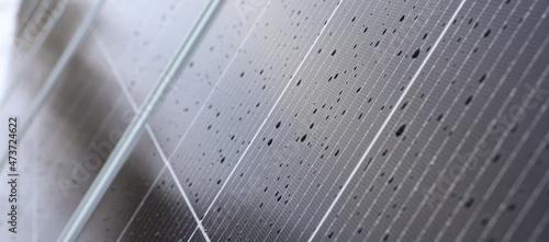 Solar panels Photovoltaic cells with water droplets. Solar panels are an alternative energy.