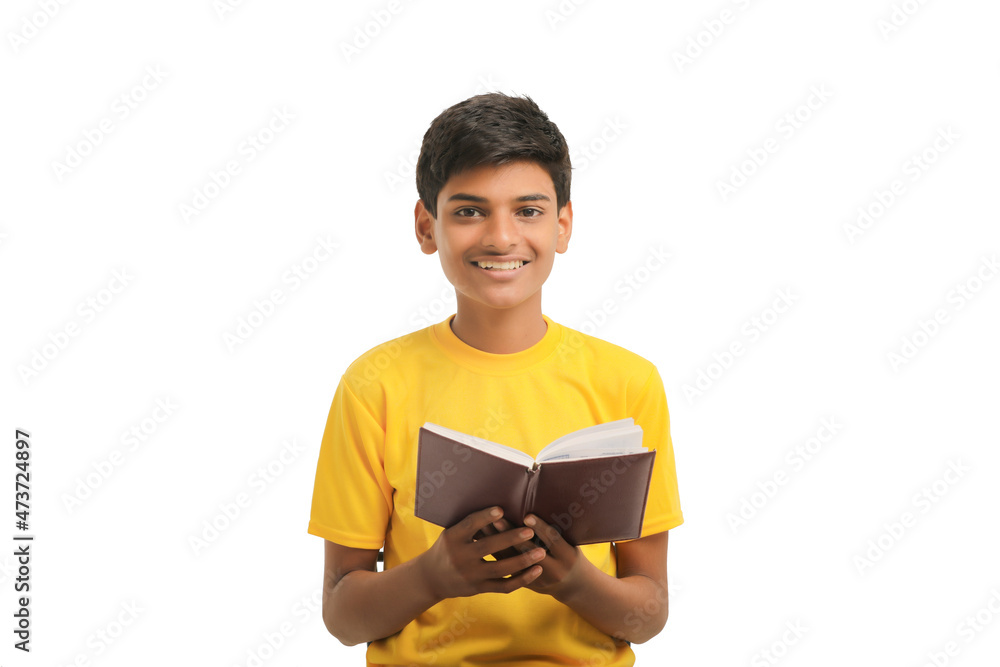 Indian boy with diary on white background. Indian boy with diary on white background.