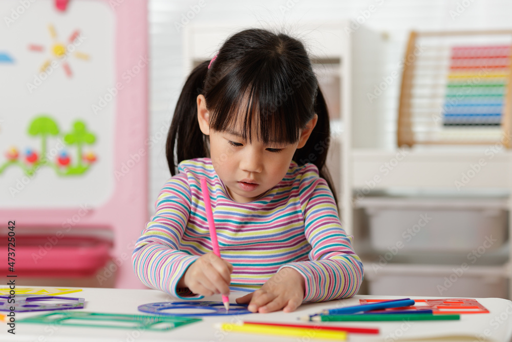 young girl drawing different shapes for homeschooling young girl drawing different shapes for homeschooling