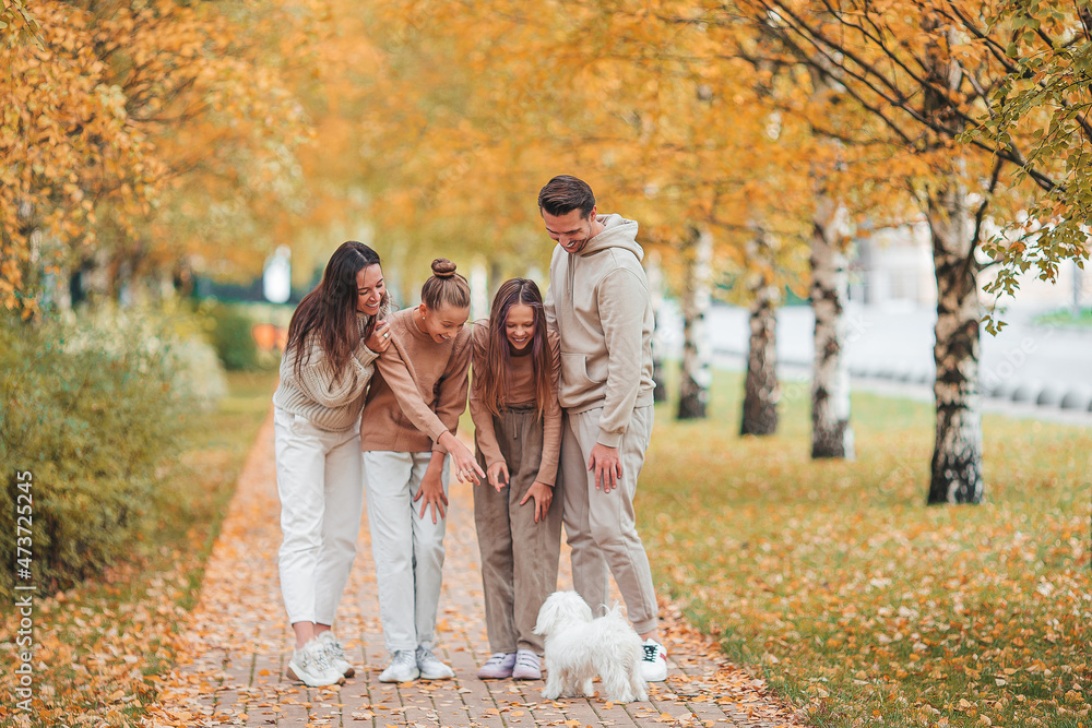 Portrait of happy family of four in autumn day Portrait of happy family of four in autumn day