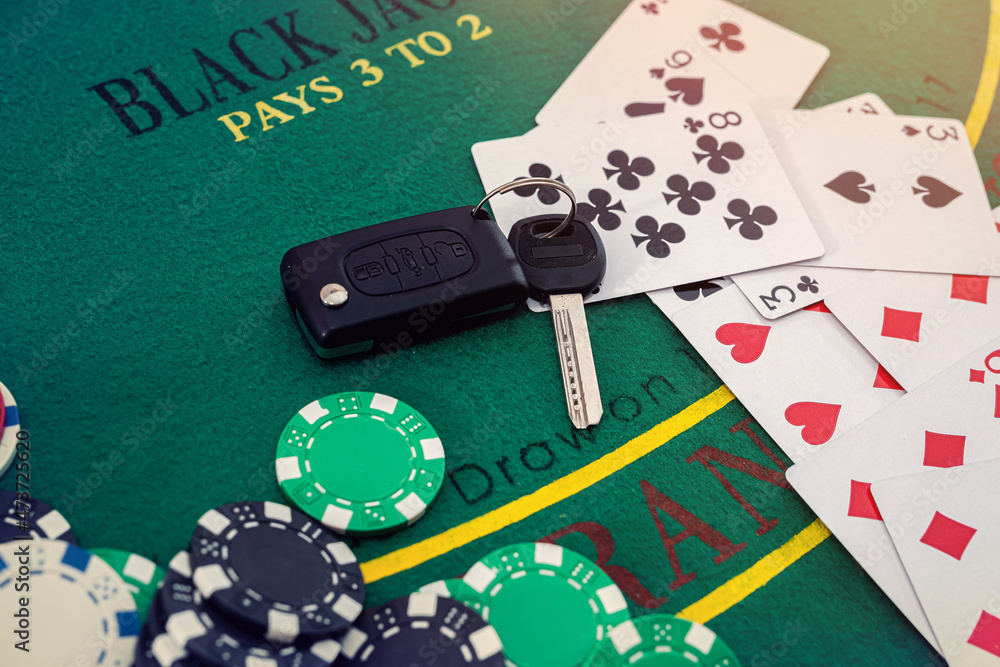 chips and cards for playing poker with risky bet with car key Stock Photo |  Adobe Stock