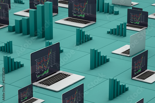 Laptops showing stock market statistics on screen photo