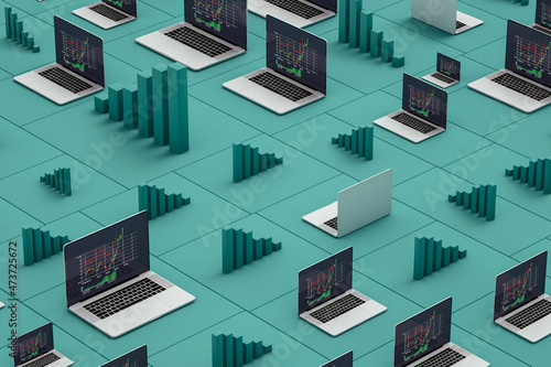 Laptops showing stock market statistics on screen photo