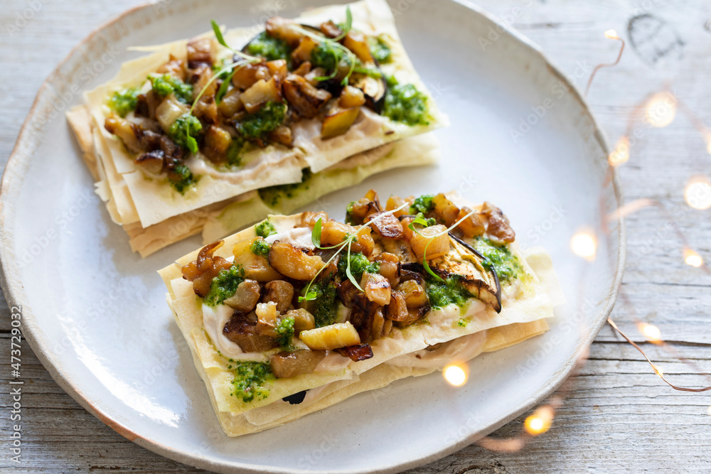 Vegan filo pastry canapes with aubergine and coriander sauce