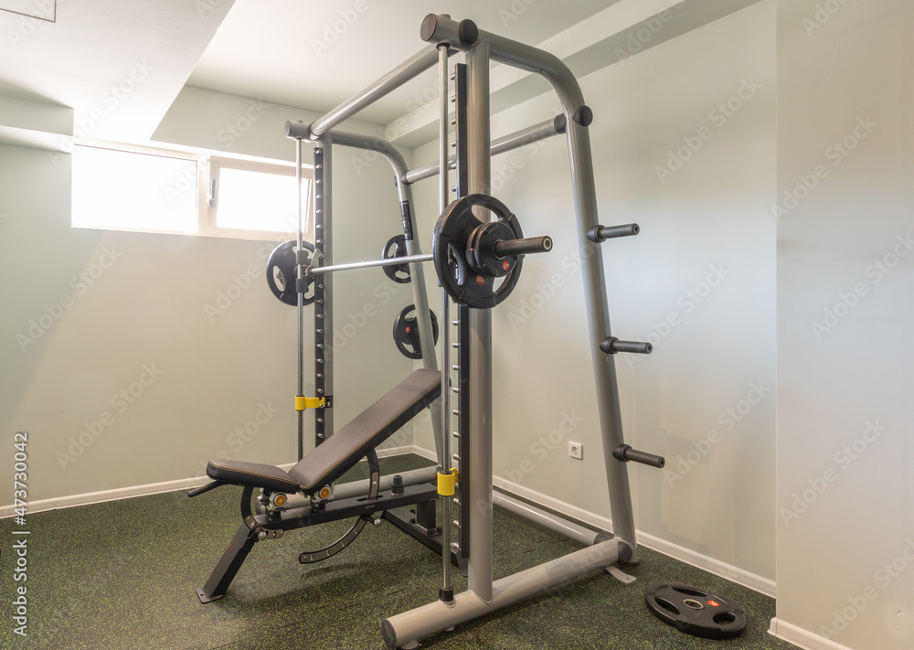 Interior of a small hotel gym with equipment Interior of a small hotel gym with equipment