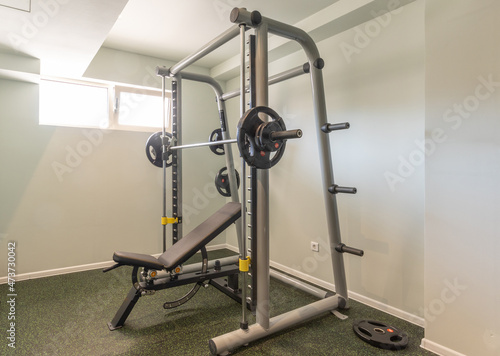Interior of a small hotel gym with equipment