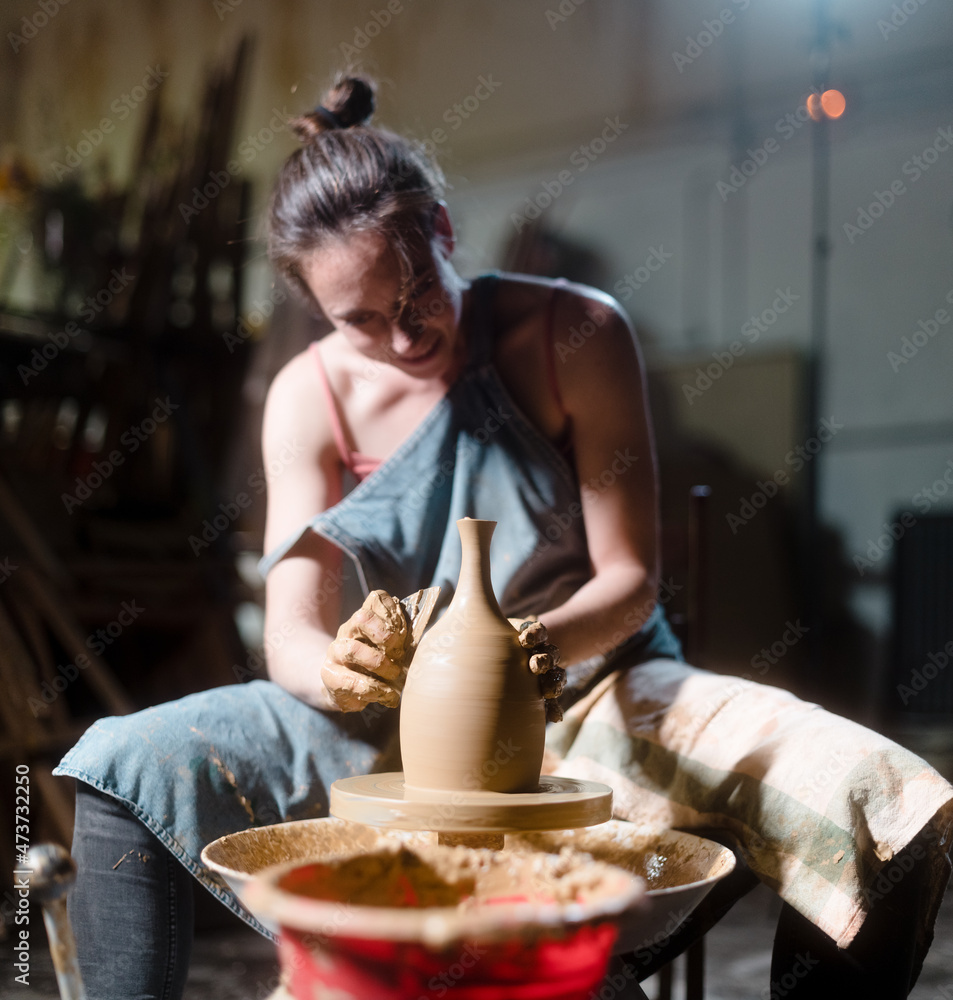 Smiling artist during pottery work Smiling artist during pottery work