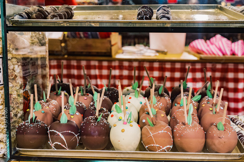 Chocolate candy apples on Christmas market display photo