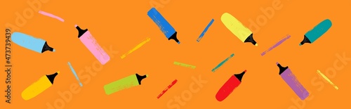 Magic markers with color lines on orange background photo