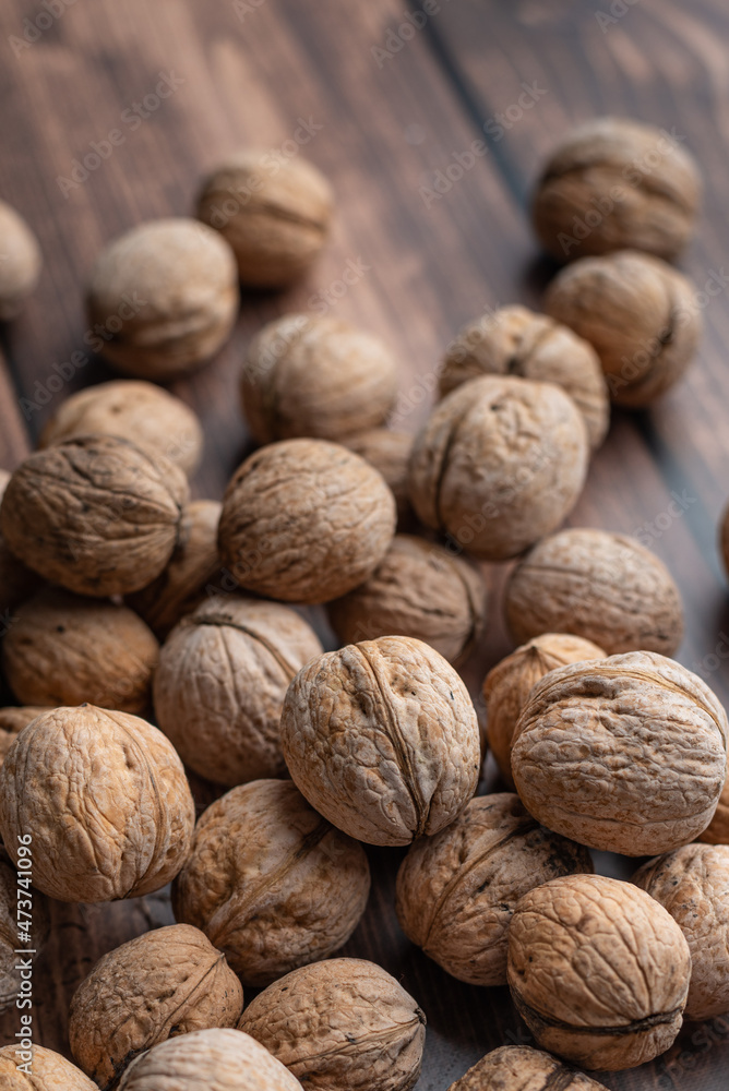 Whole walnuts on a wooden table Whole walnuts on a wooden table